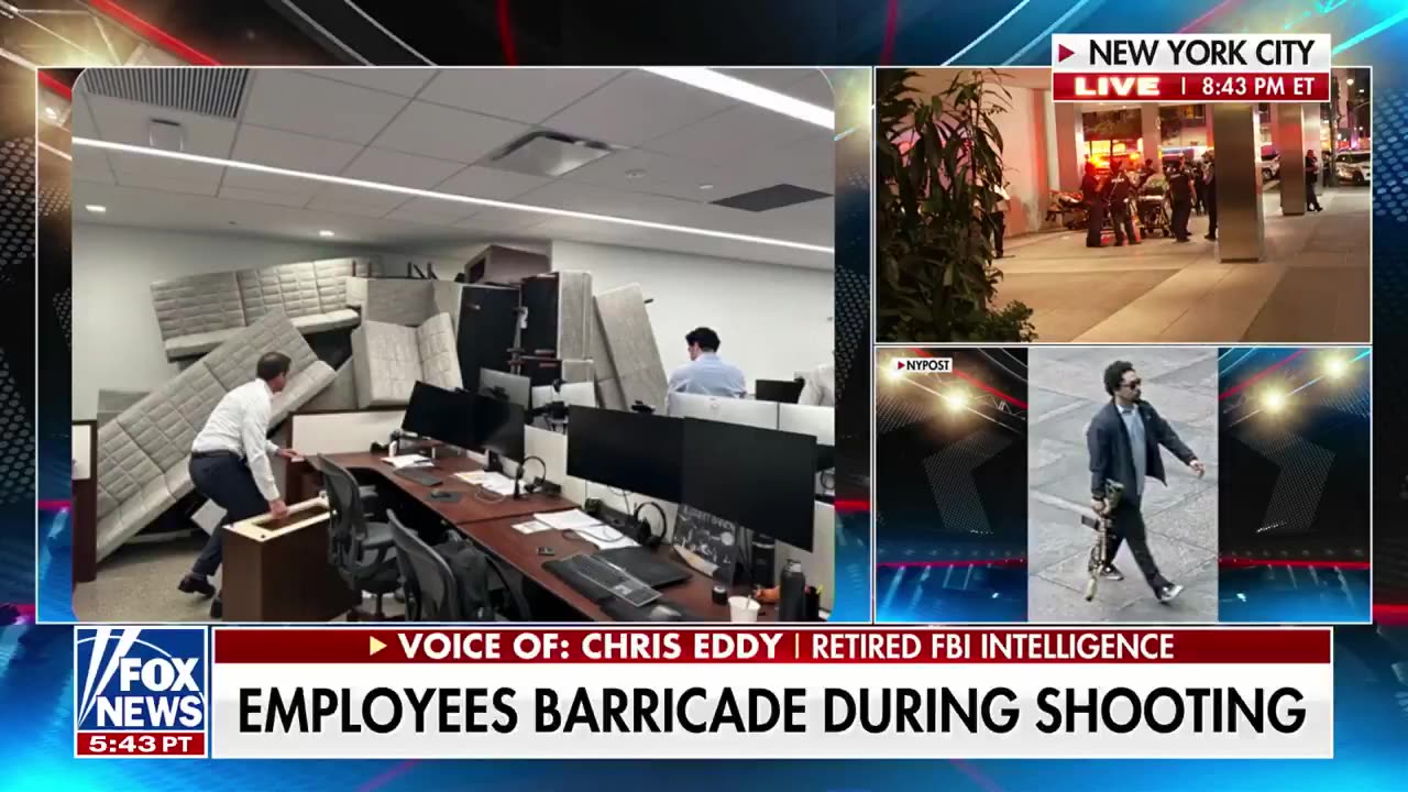 A chilling photo captures employees taking cover behind barricades inside a New York City building