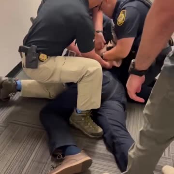Senator Padilla gets forced to the ground and cuffed.