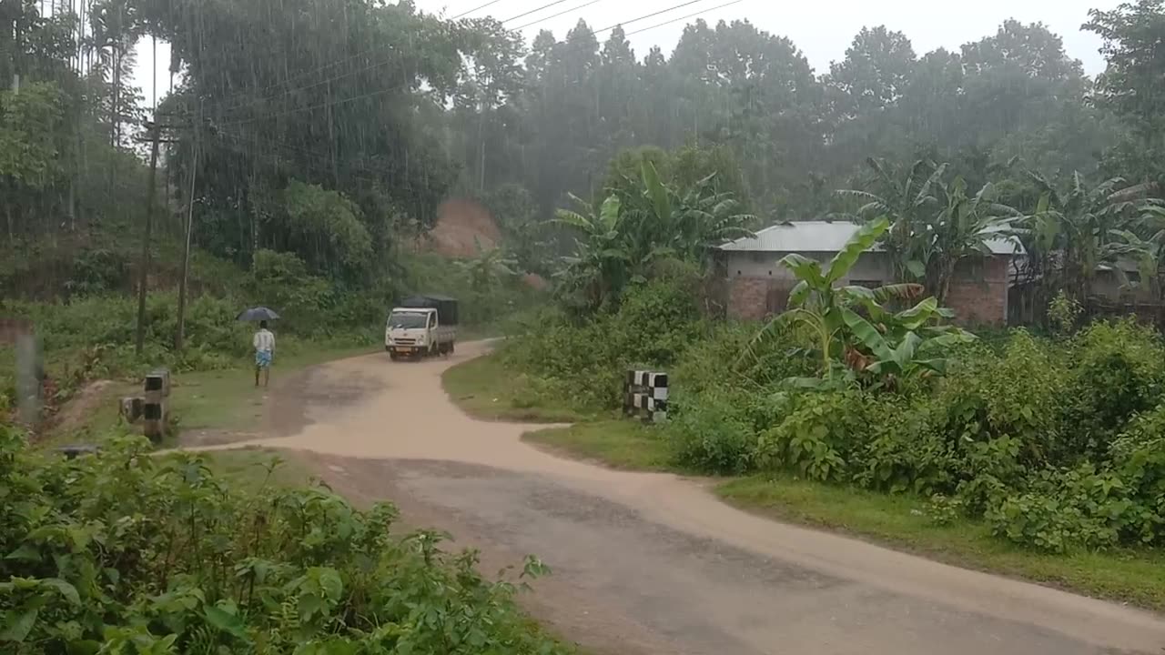 I am standing on the hill and it is raining too