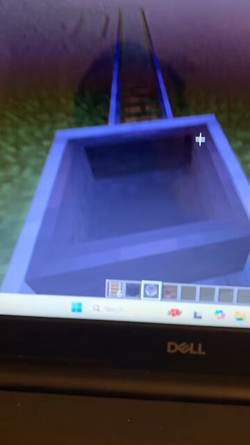 I built a race car track with a little race car to drive in Minecraft