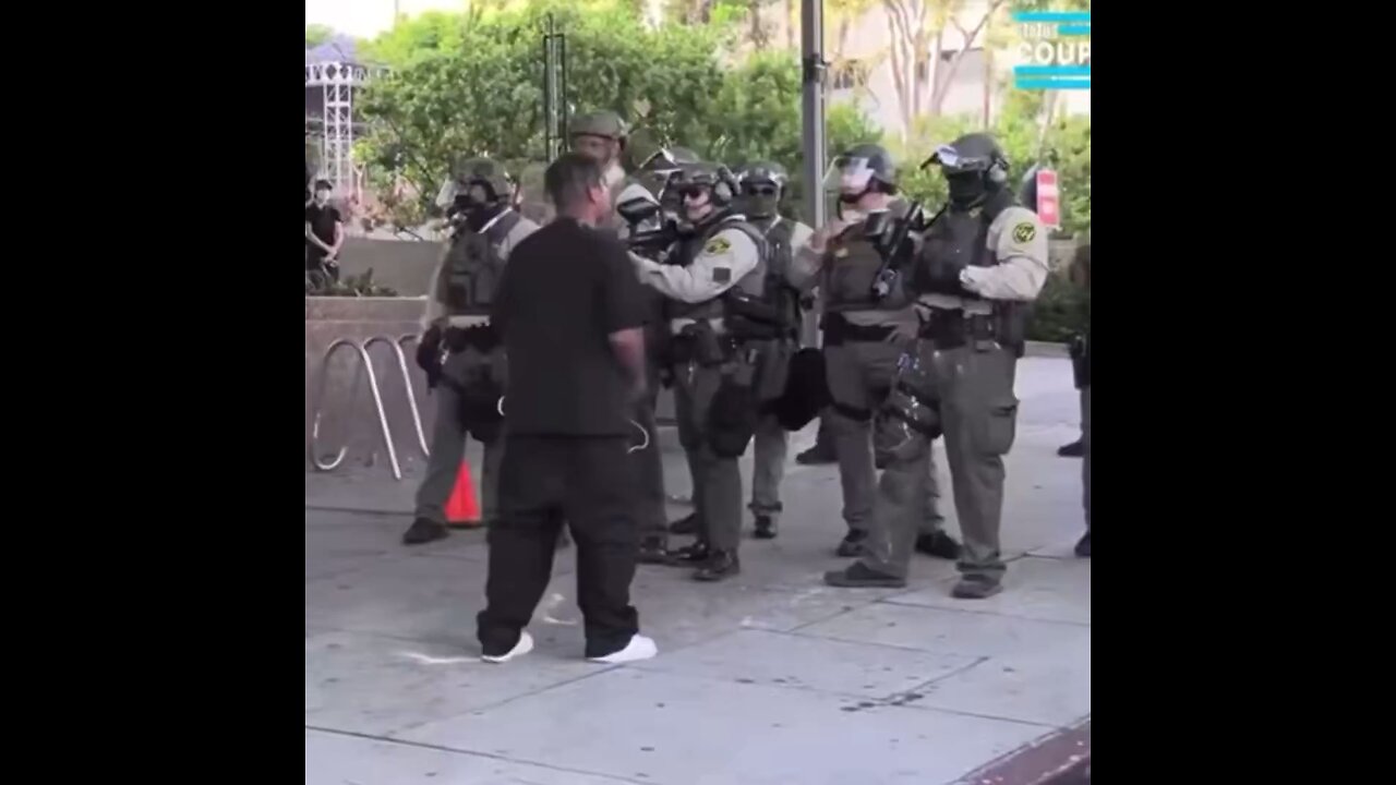 A protestor threw a can at a cop and was tackled to the ground by a bystander in Los Angeles. 🤣🤣