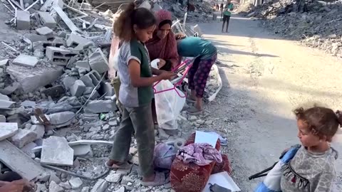 Palestinians in Gaza City keep house keys as homes lie destroyed