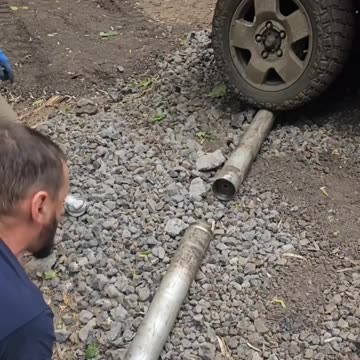 Russians Disassemble A Grad Rocket to Extract Gunpowder for Drone Bombs