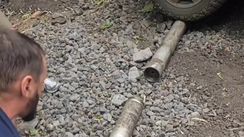 Russians Disassemble A Grad Rocket to Extract Gunpowder for Drone Bombs