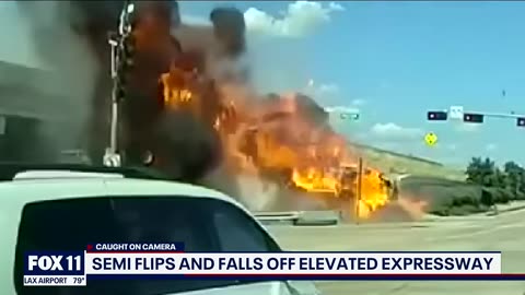18-wheeler flips over barrier; Driver killed in fiery crash