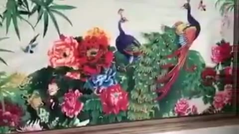 A wall printer equipped with ultrasonic sensors that can print any image from flat graphics