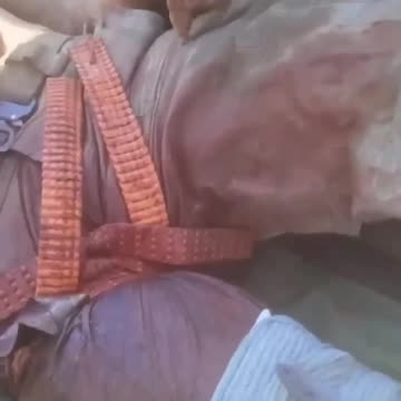 Russians Evacuate Wounded Inside Trash Can Attached to Motorcycle