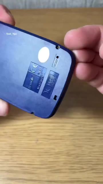 Hands Using a Precision Screwdriver on a Small Electronic Device