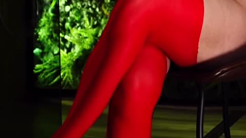 sexy dance anchor in tight shorts, suspenders, mesh thigh-highs,