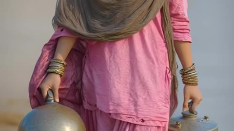 gorgeous and beautiful pathani girl with a slightly large nose, wearing a pink shalwar kamees