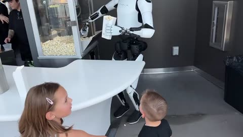 Optimus at work serving popcorn to children!