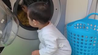 Little one learns laundry magic!.hd