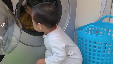 Little one learns laundry magic!.hd