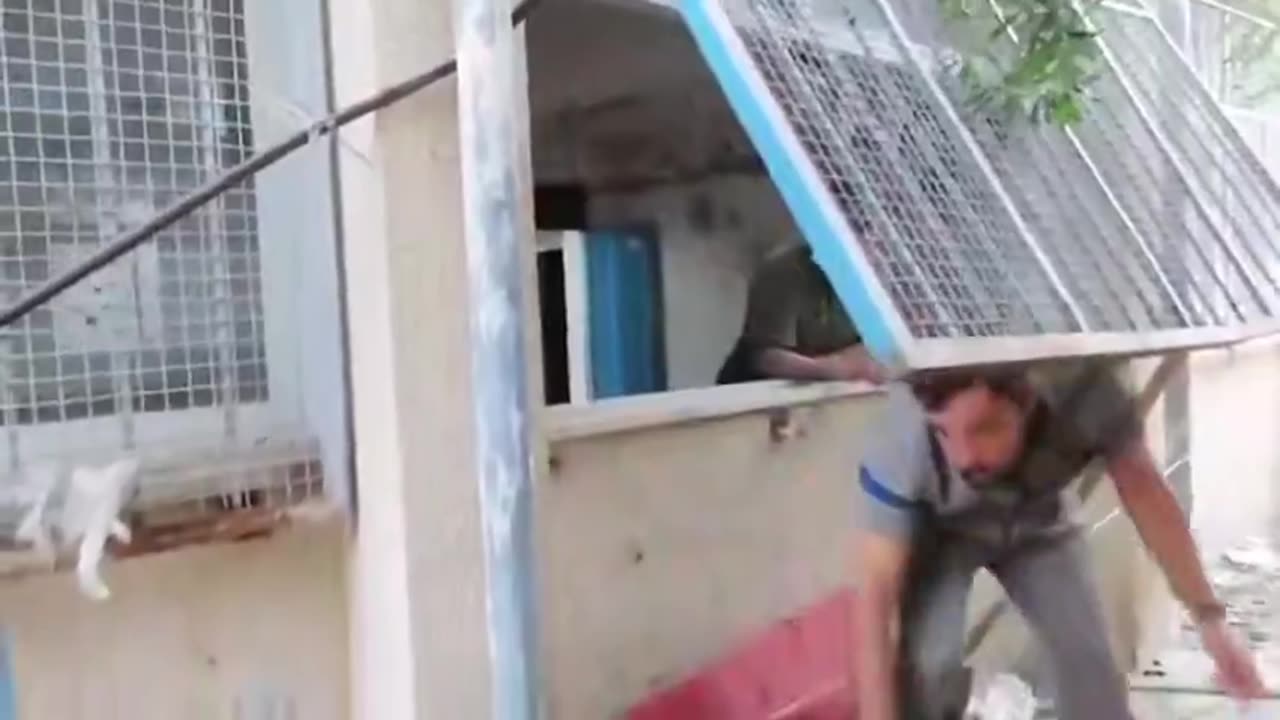 Documentation of Hamas terrorists removing weapons from a well