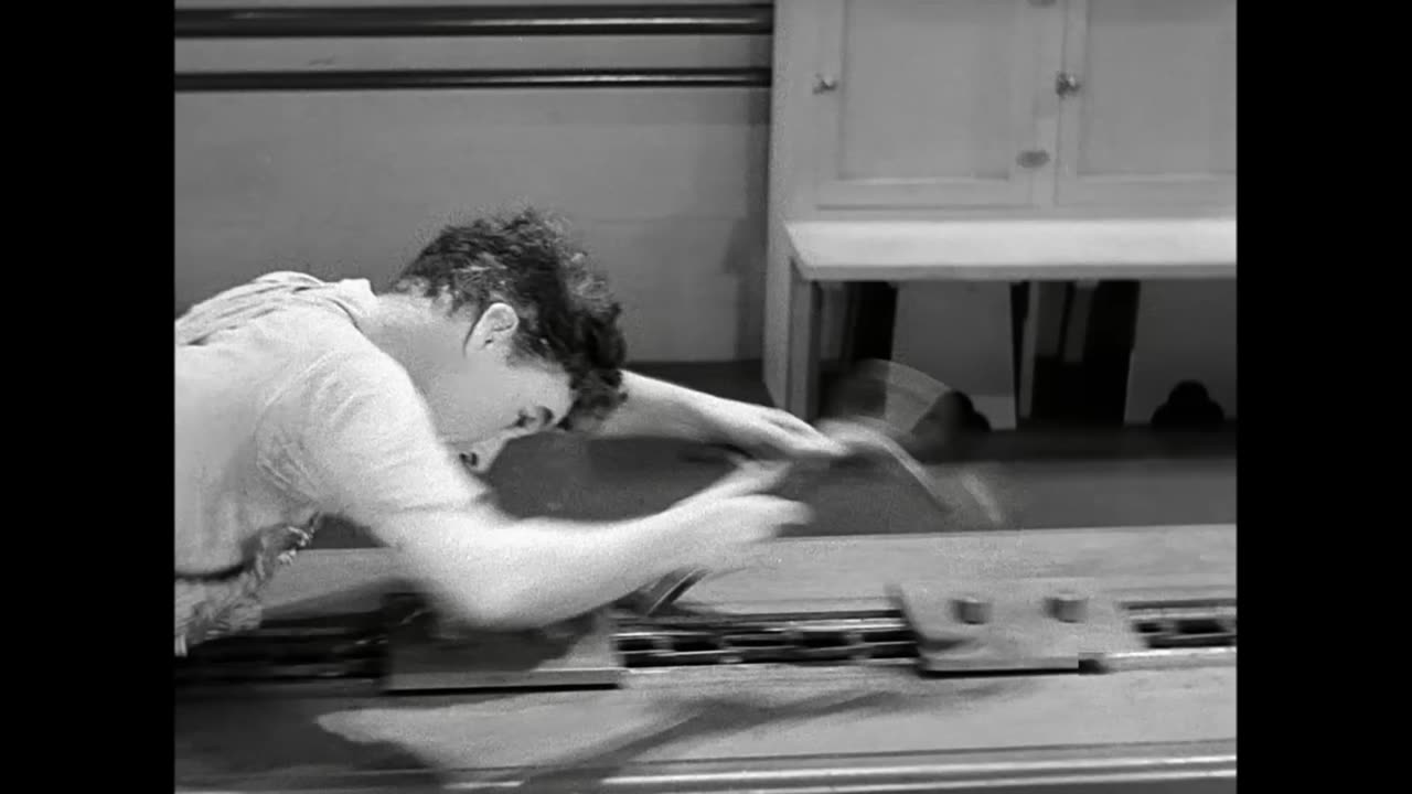 Charlie_Chaplin_Swallowed_by_a_Factory_Machine_-_Modern_Times__