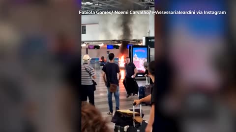 Travelers flee as fire breaks out at Milan airport