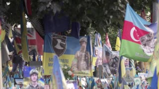 Prince Harry holds back tears at a makeshift memorial in Kyiv