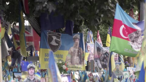 Prince Harry holds back tears at a makeshift memorial in Kyiv