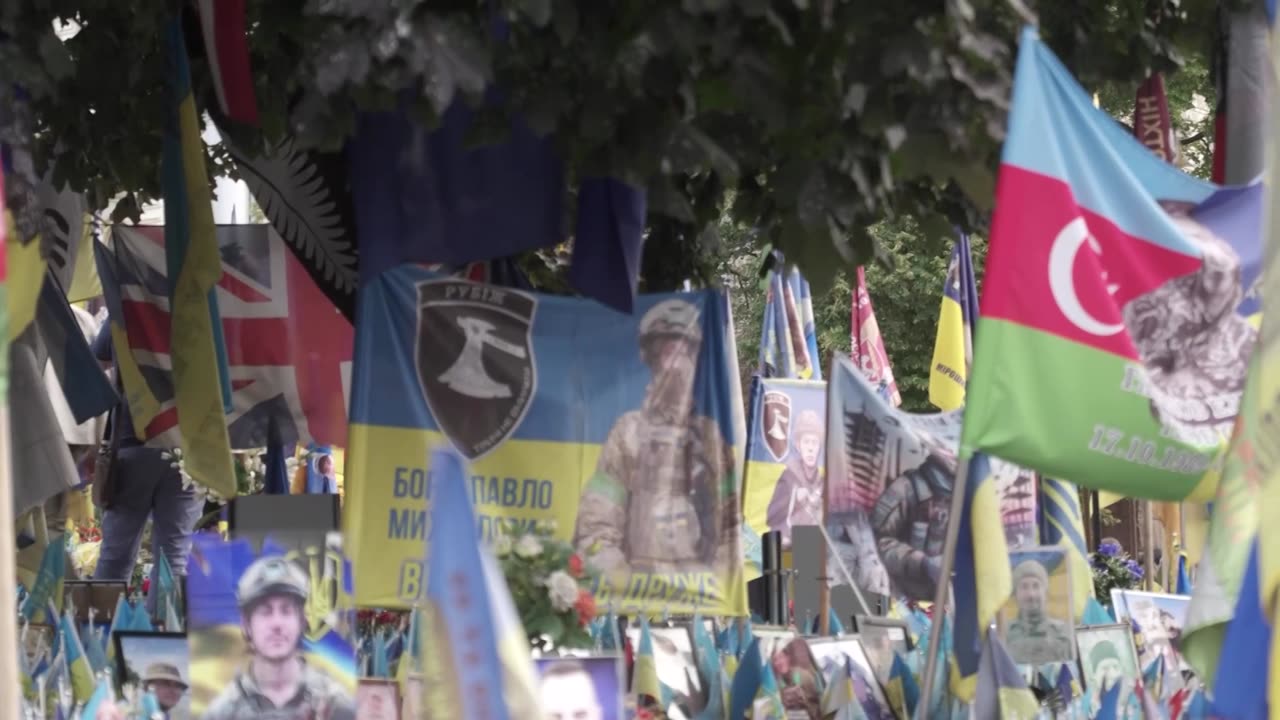 Prince Harry holds back tears at a makeshift memorial in Kyiv