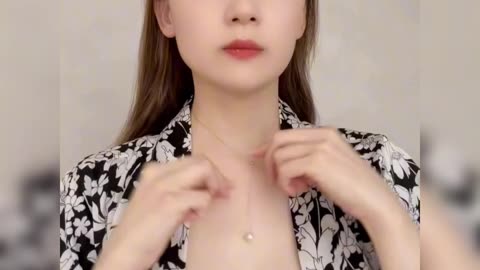 The beautiful, sexy girl tries on a new dress.