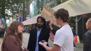 Protestor couple disagrees on deportation of illegal immigrants, awkward