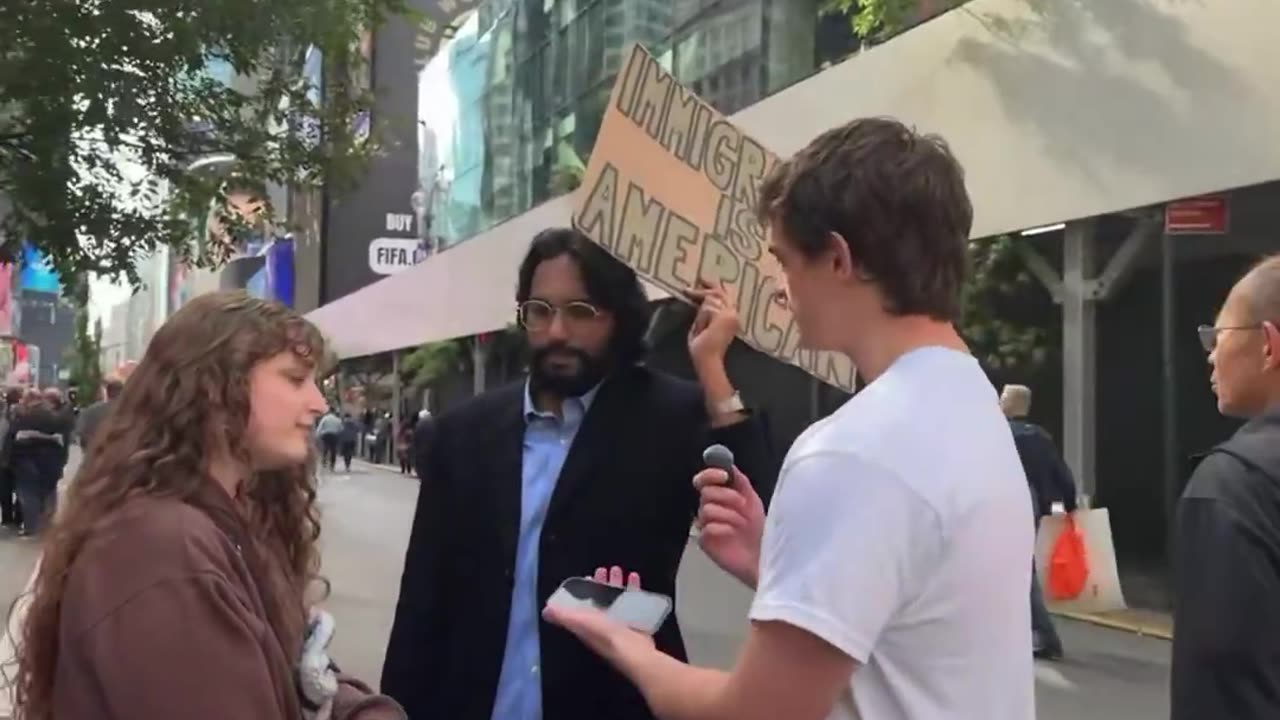 Protestor couple disagrees on deportation of illegal immigrants, awkward