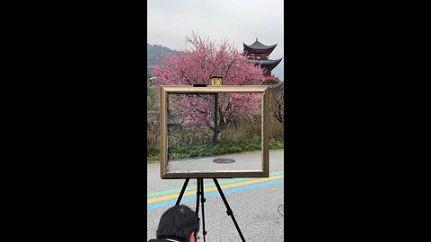 people walking in front of plum blossom tree
