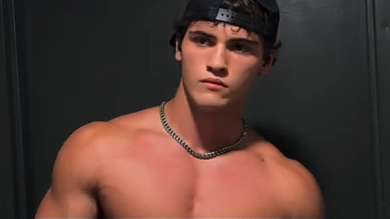 20 years old bodybuilder flexing muscles