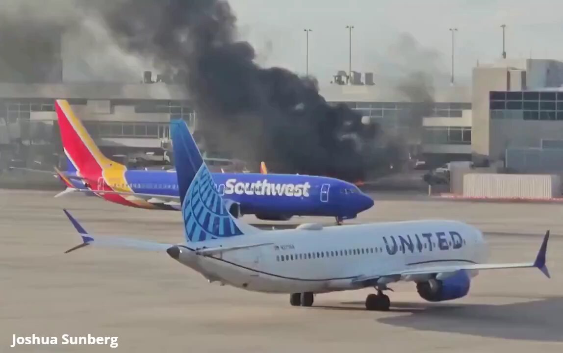 Passengers seen running through the smoke as an AA flight catches fire at Denver International