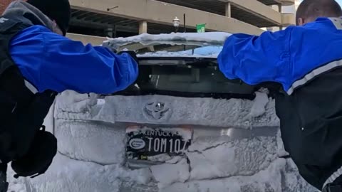 Officers Help Driver Stuck in Snow