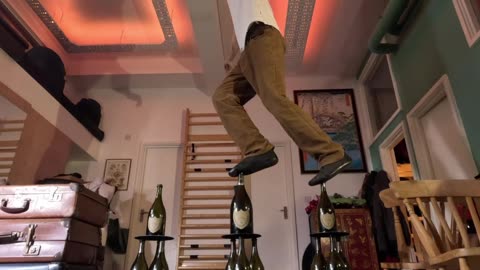 Walking On Triple Stacks Of Glass Bottles