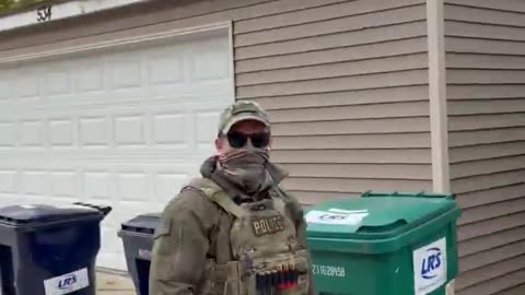 A Karen yells and screams at DHS agents who kind look on at her like she is an animal in the zoo.