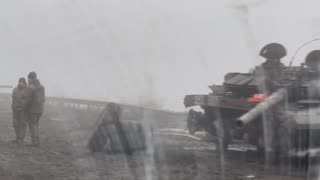 Russian Soldiers Dealing with Over a Dozen Tanks and APCs Lining the Roadway