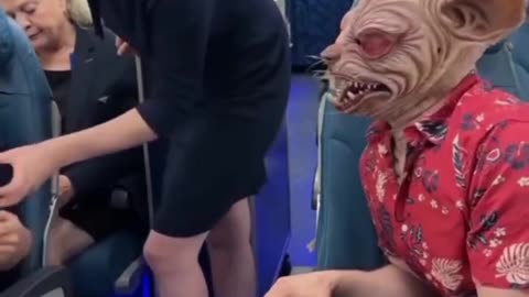 Flight Attendant’s Reaction to This Scary Mask is Priceless! 😂👹"