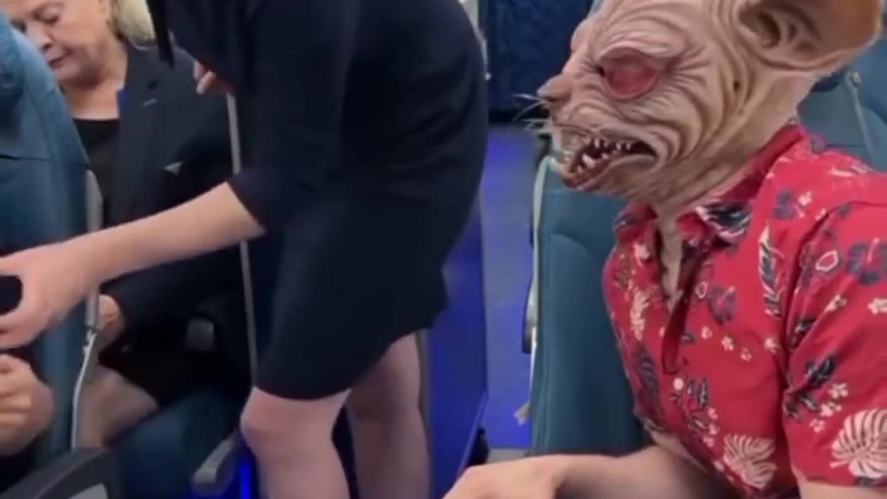 Flight Attendant’s Reaction to This Scary Mask is Priceless! 😂👹"
