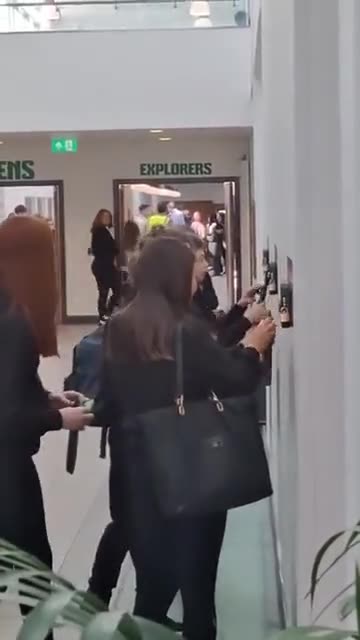 Students use phone locking stations at Scotland’s first 'phone-free' school