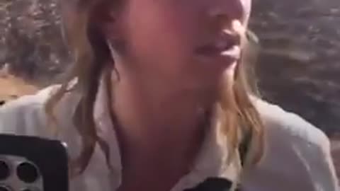 Armed Israeli settlers draining Palestinian water tank