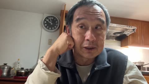 Luodong Massages His Face At Home In The Kitchen