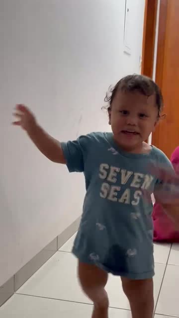 Father Hiding Under Blankets Startles Son