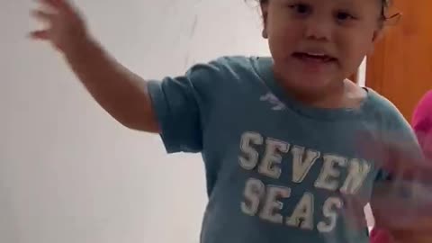 Father Hiding Under Blankets Startles Son