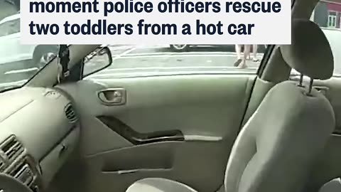 Bodycam footage shows the moment police officers rescue two toddlers from a hot car