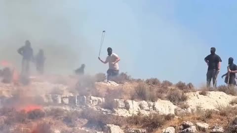 Palestinians confront Israeli settlers who attacked the village of Singil, north of Ramallah