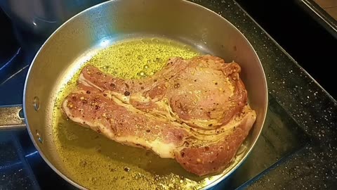BONE-IN PORK CHOPS -STIR FRY VEGETABLES AND BAKED POTATO