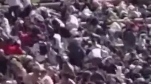 WATCH as George Zinn in the crowd appears to set something down…