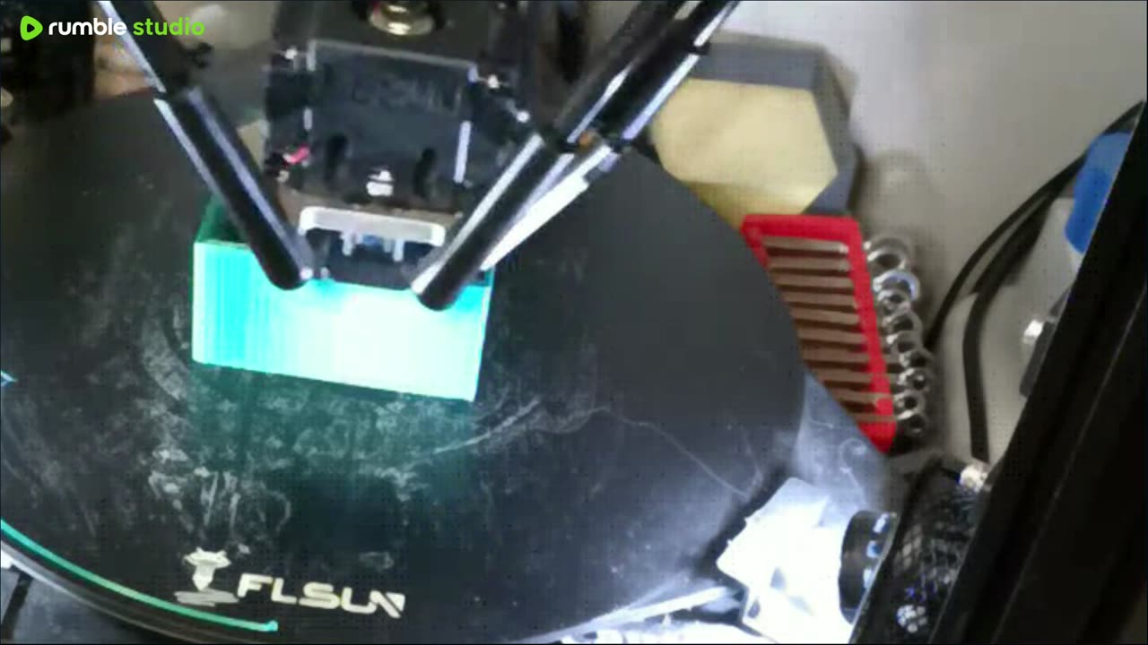 3D printing a sugar packet dispenser.