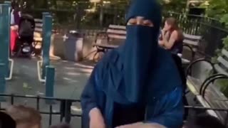 A teacher cannot teach with her face covered.