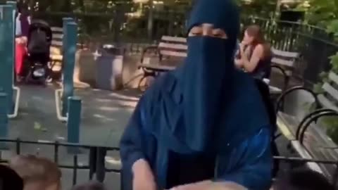 A teacher cannot teach with her face covered.