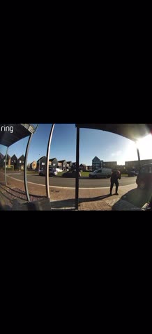 Distracted Man Walks Face-First Into Metal Pole