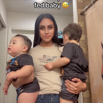 Mother of two kids shows the difference in size between her formula fed baby and