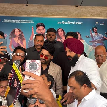 kapil sharma seen clicking selfies with fans at the trailer launch of his movie
